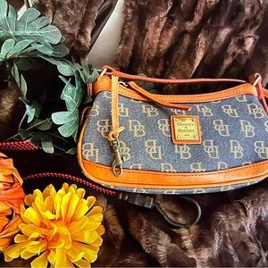 Dooney & Bourke purse    New.  Great color and tan leather